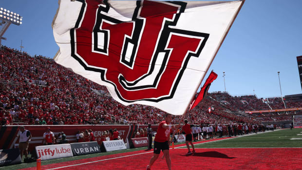Sep 16, 2023; Salt Lake City, Utah, USA; The Utah Utes cheer team waves a flag after a touchdown against the Weber State Wildcats in the first half at Rice-Eccles Stadium. Mandatory Credit: Rob Gray-USA TODAY Sports